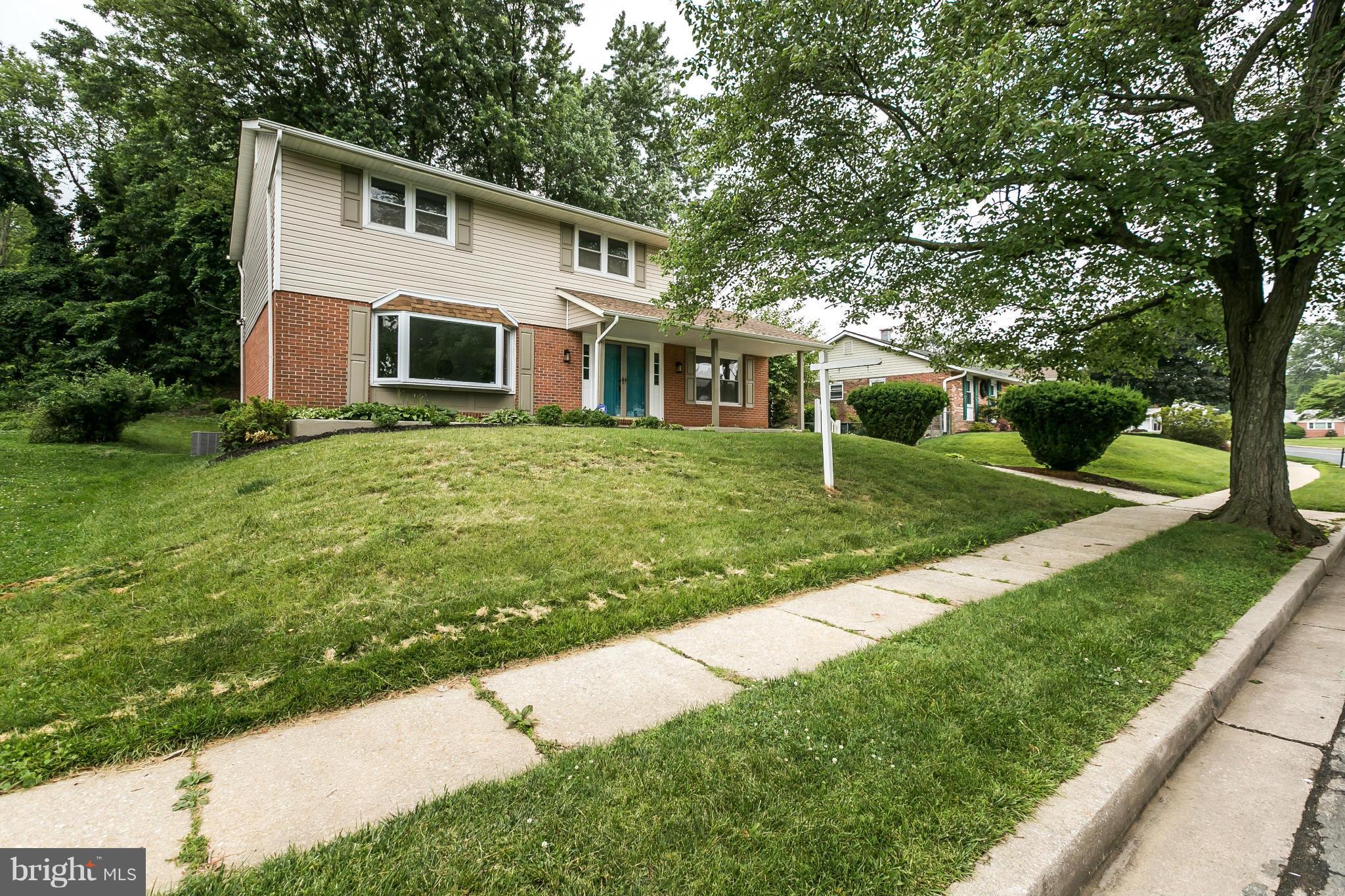 4527 Tapscott Road Baltimore, MD 21208 - Photo 29 of 30 a front view of a house with a yard
