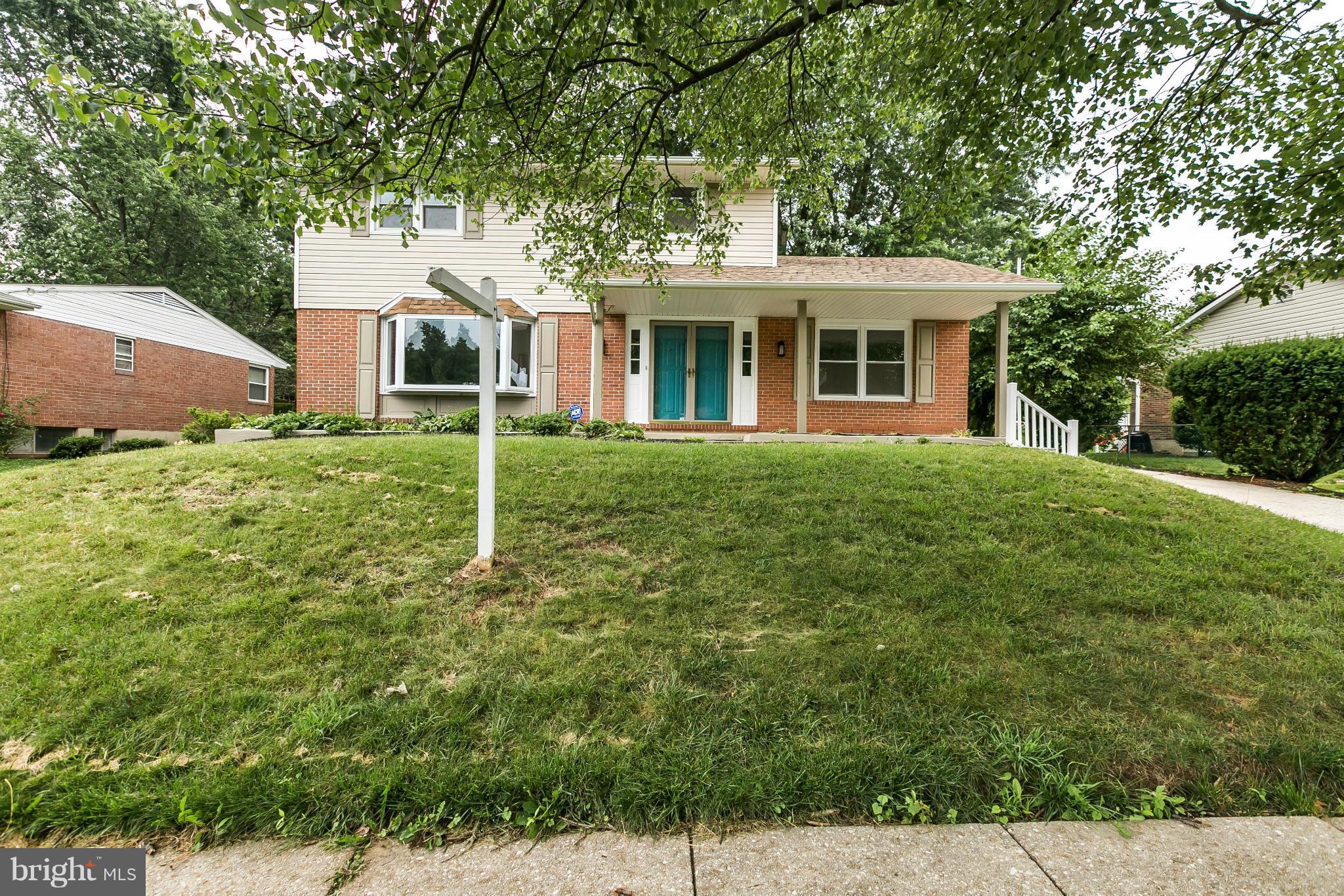 4527 Tapscott Road Baltimore, MD 21208 - Photo 30 of 30 a front view of a house with a yard