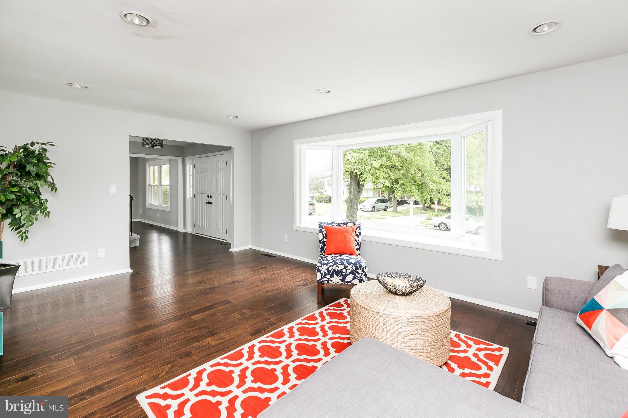 4527 Tapscott Road Baltimore, MD 21208 - Photo 6 of 30 a living room with furniture and a large window
