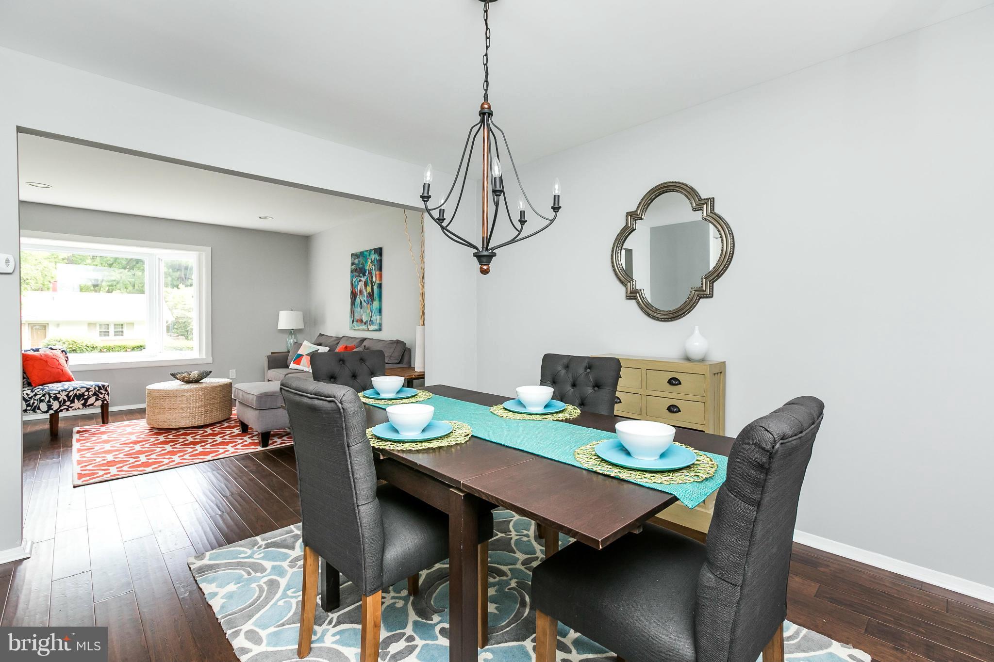 4527 Tapscott Road Baltimore, MD 21208 - Photo 8 of 30 a view of a dining room with furniture window and wooden floor