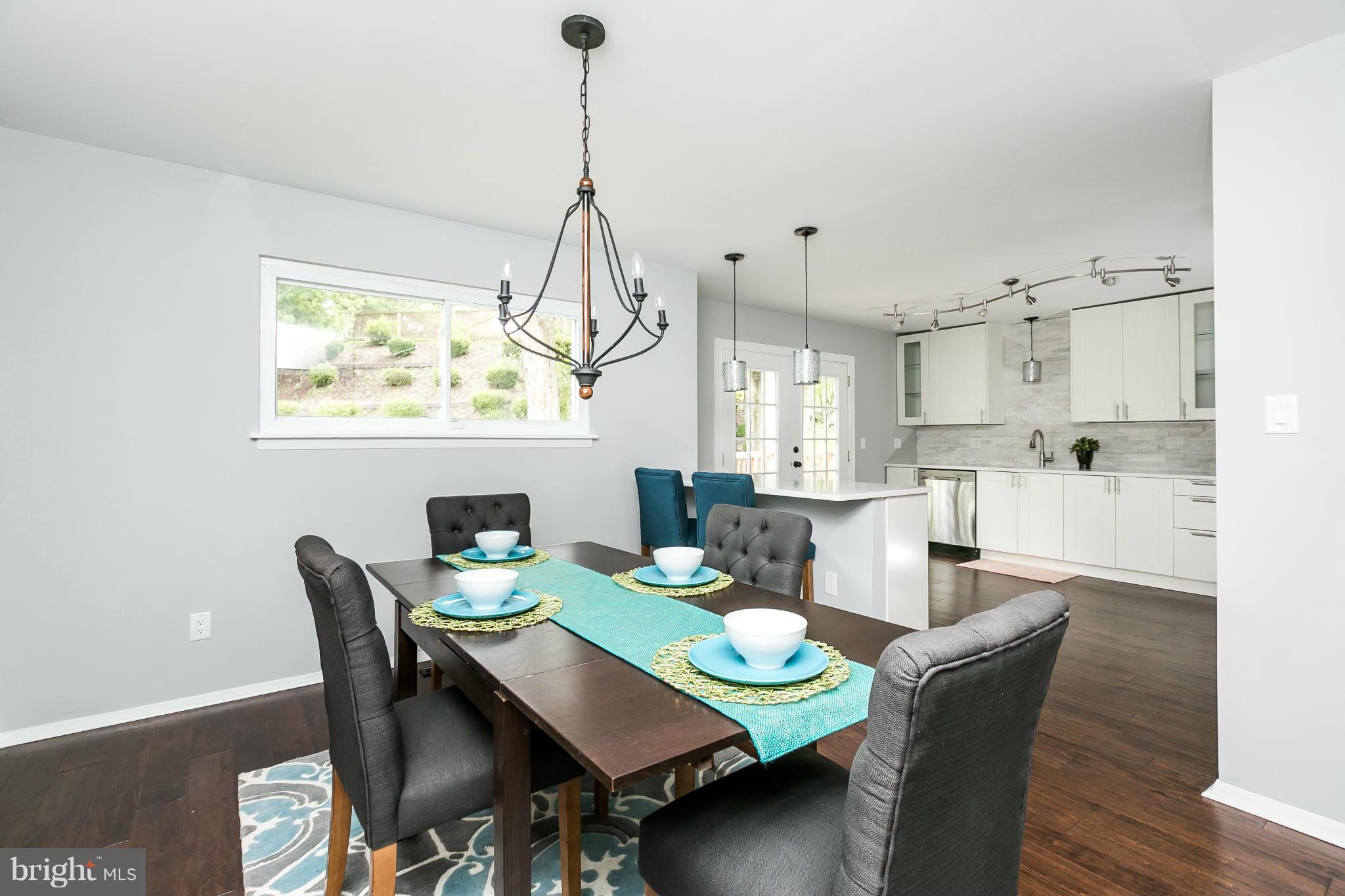 4527 Tapscott Road Baltimore, MD 21208 - Photo 9 of 30 a view of a dining room with furniture window and wooden floor