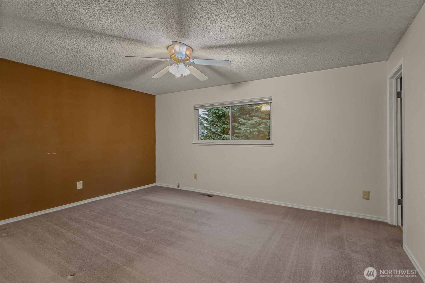 2207 Bremerton Avenue Northeast Renton, WA 98059 - Photo 12 of 40 an empty room with a window and a fan