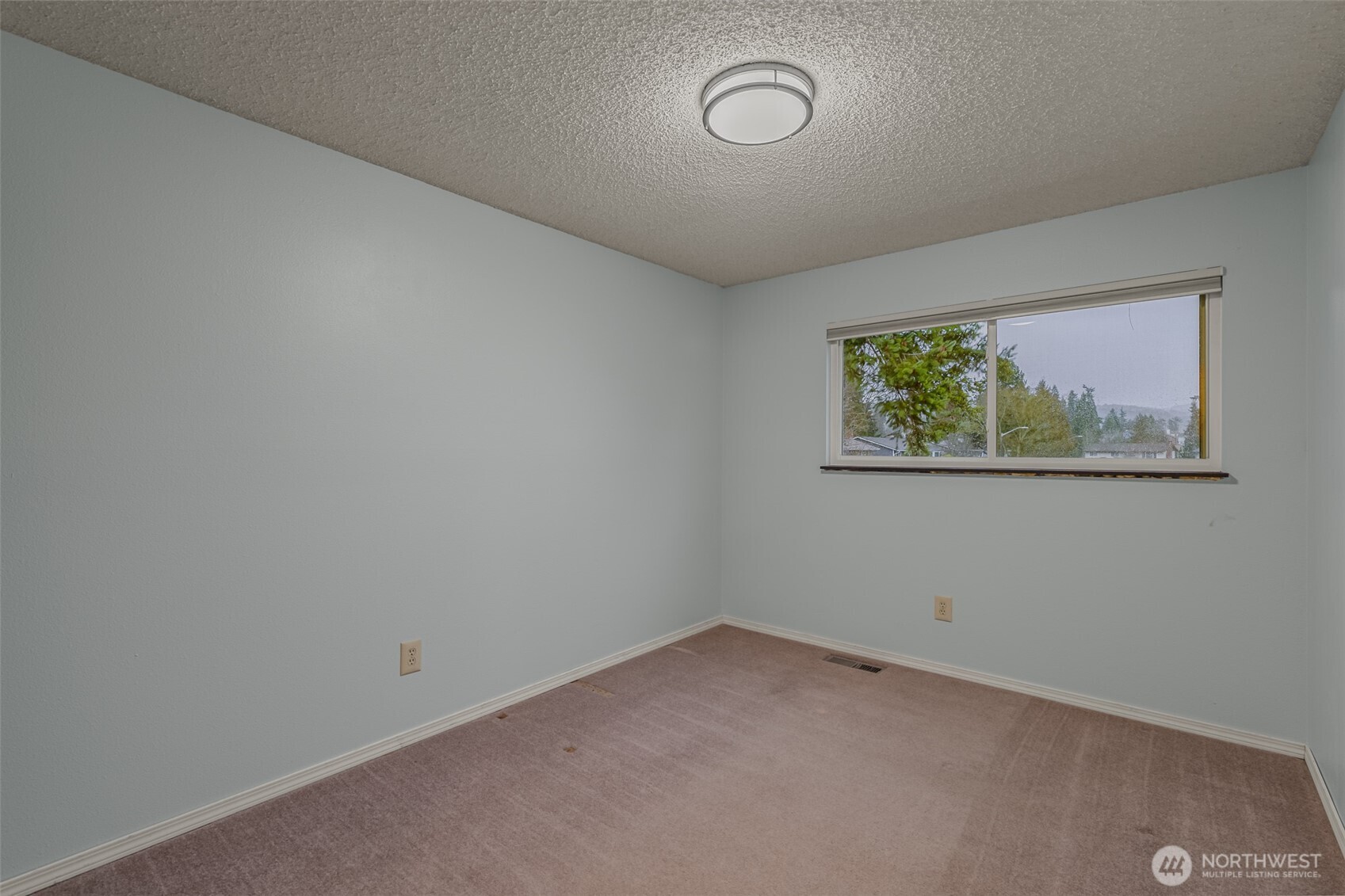 2207 Bremerton Avenue Northeast Renton, WA 98059 - Photo 19 of 40 an empty room with a window