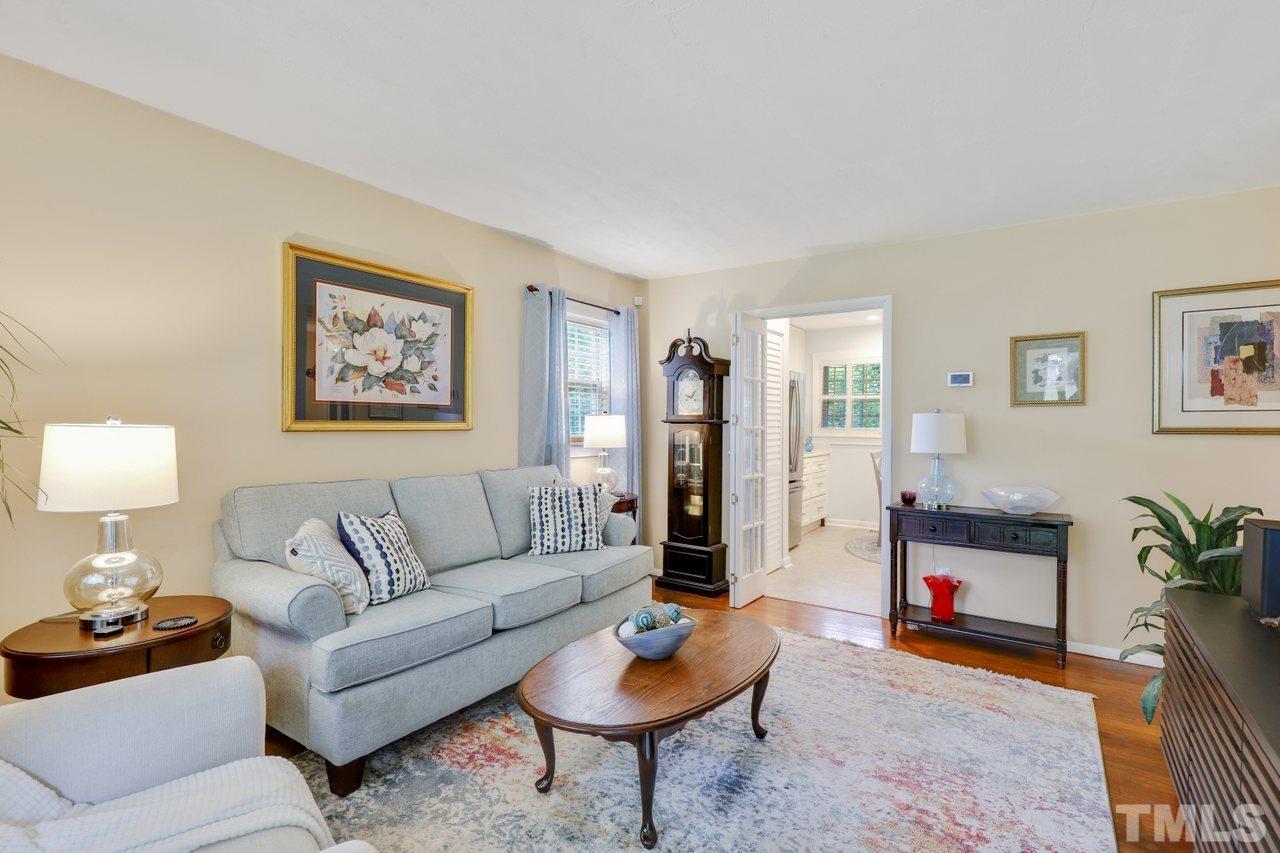 1306 Valley Road Garner, NC 27529 - Photo 3 of 18 a living room with furniture and a wooden floor