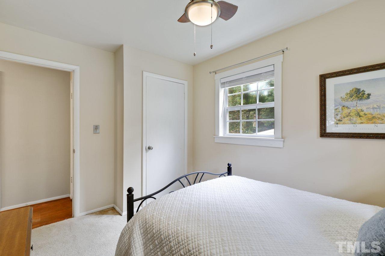 1306 Valley Road Garner, NC 27529 - Photo 10 of 18 a bedroom with a bed and a window