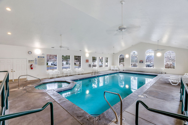 986 Independence Avenue Provo, UT 84604 - Photo 24 of 29 Indoor swimming pool featuring an integrated hot tub and vaulted ceilings