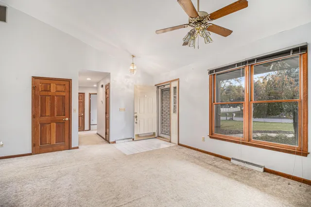 a view of livingroom with hardwood floor and ceiling fan