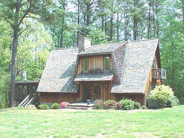 834 Foster Road Henderson, NC 27537 - Photo 1 of 1 a front view of a house with garden