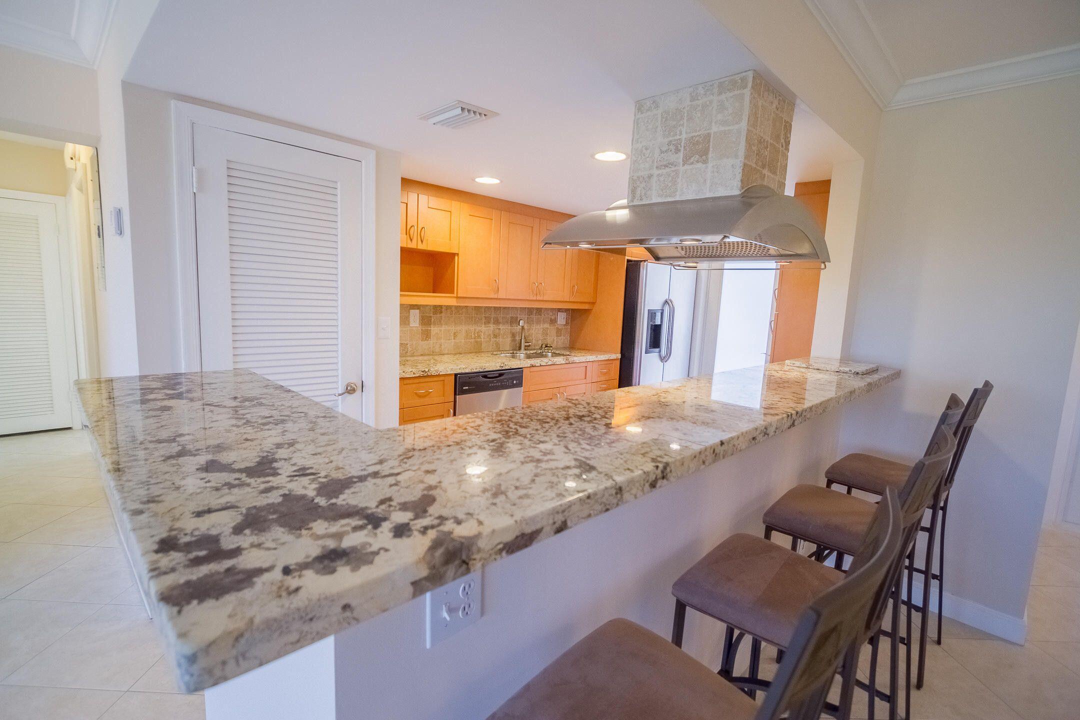 300 East Royal Palm Road, Unit 42B Boca Raton, FL 33432 - Photo 46 of 51 a view of kitchen island and living room