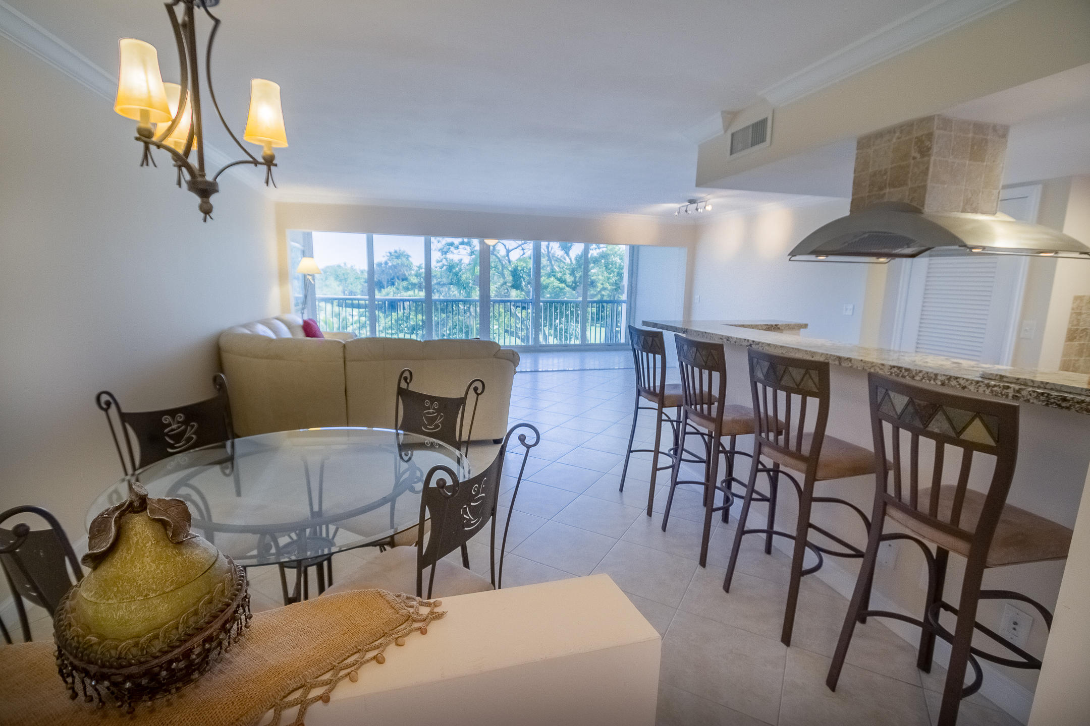 300 East Royal Palm Road, Unit 42B Boca Raton, FL 33432 - Photo 10 of 51 a view of a dining room with furniture window and outside view