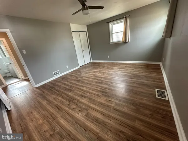 a view of room with window and hardwood floor