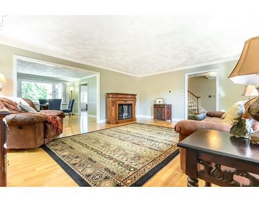 7 Snowberry Road Andover, MA 01810 - Photo 11 of 30 a living room with furniture and a flat screen tv