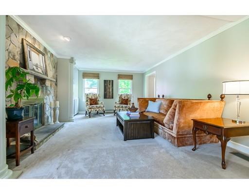 7 Snowberry Road Andover, MA 01810 - Photo 12 of 30 a living room with furniture and a lamp