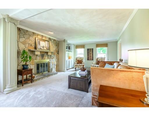 7 Snowberry Road Andover, MA 01810 - Photo 13 of 30 a living room with furniture a fireplace and a large window