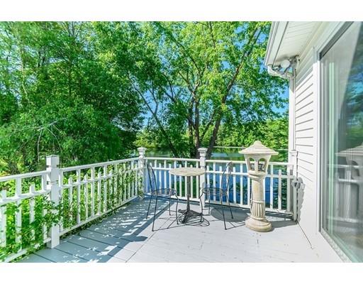 7 Snowberry Road Andover, MA 01810 - Photo 15 of 30 a view of a chair and table in the back yard