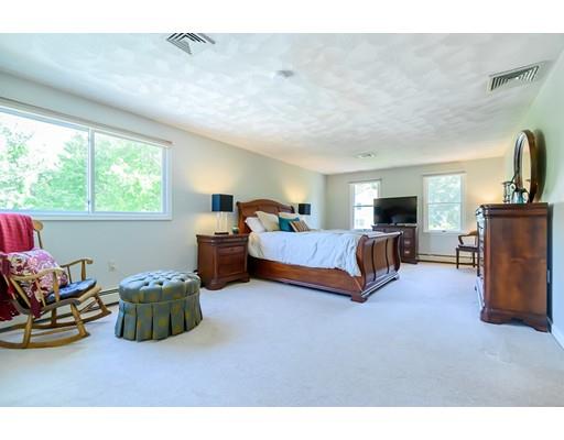 7 Snowberry Road Andover, MA 01810 - Photo 18 of 30 a living room with furniture and a flat screen tv
