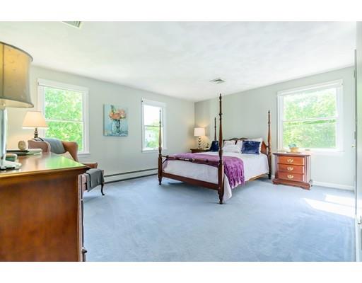 7 Snowberry Road Andover, MA 01810 - Photo 21 of 30 a spacious bedroom with a bed and wooden floor