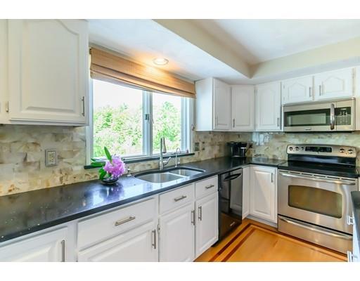 7 Snowberry Road Andover, MA 01810 - Photo 5 of 30 a kitchen with stainless steel appliances a stove a sink a microwave and cabinets