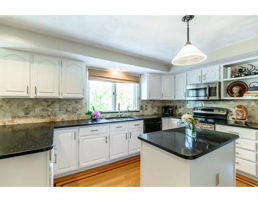 7 Snowberry Road Andover, MA 01810 - Photo 6 of 30 a kitchen with stainless steel appliances granite countertop a sink stove and refrigerator