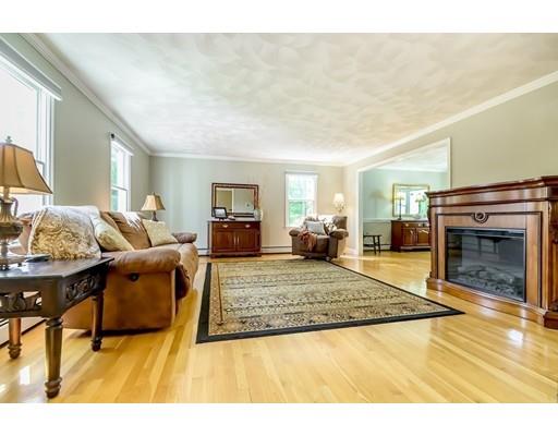 7 Snowberry Road Andover, MA 01810 - Photo 10 of 30 a living room with furniture and a fireplace