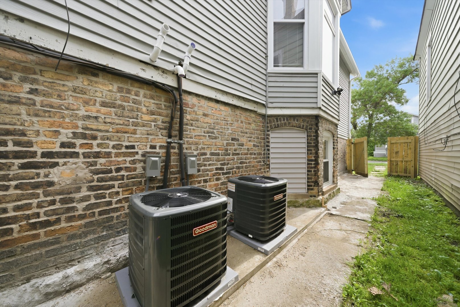 7828 South Escanaba Avenue Chicago, IL 60649 - Photo 36 of 41 a view of a backyard with chairs and a stove