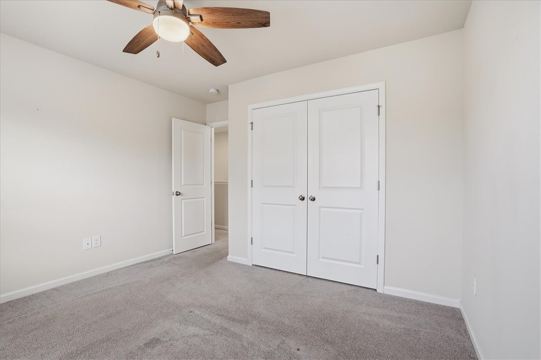 365 Sliding Rock Drive Pendleton, SC 29670 - Photo 22 of 46 Well-lit and tranquil, this room offers ample space for relaxation with its plush carpeting.