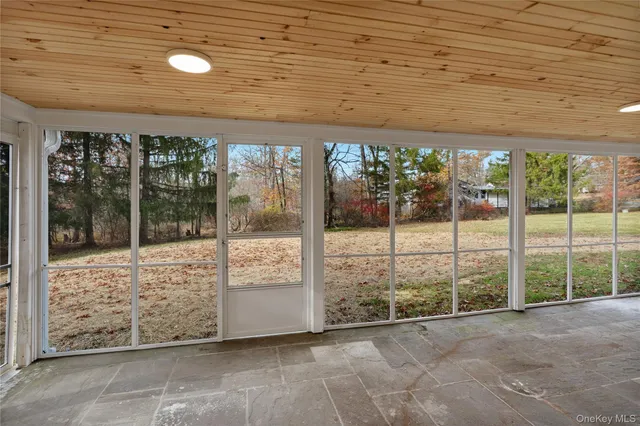 a view of a porch and garden