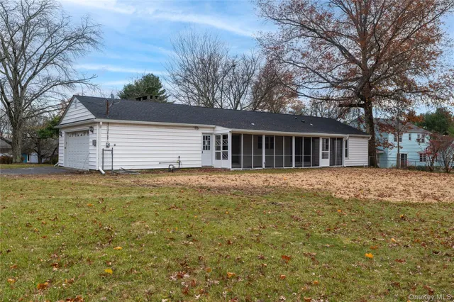 a backyard of a house with large trees