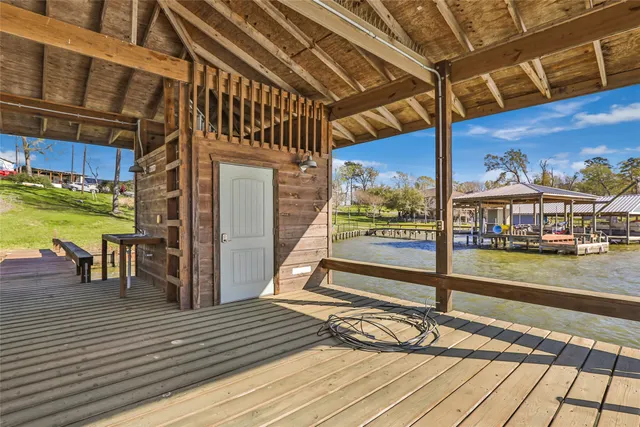 a view of a balcony with wooden floor