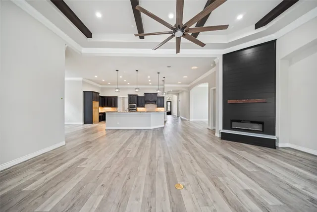 a view of a kitchen with a sink and a refrigerator