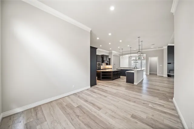 a view of a kitchen with a sink and cabinets