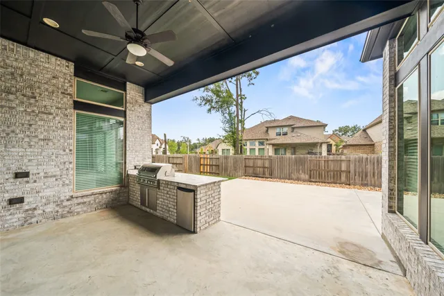 a view of an outdoor dining space with a large window