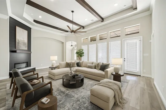 a living room with furniture and a large window