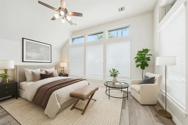 a bedroom with a bed and a couch