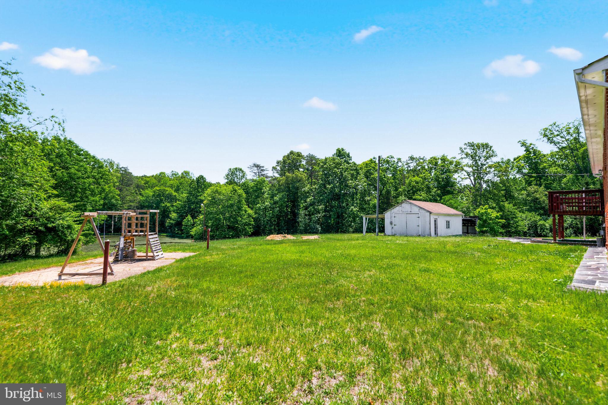 11325 Bacon Race Road Woodbridge, VA 22192 - Photo 48 of 54 a view of a backyard with a garden and entertaining space
