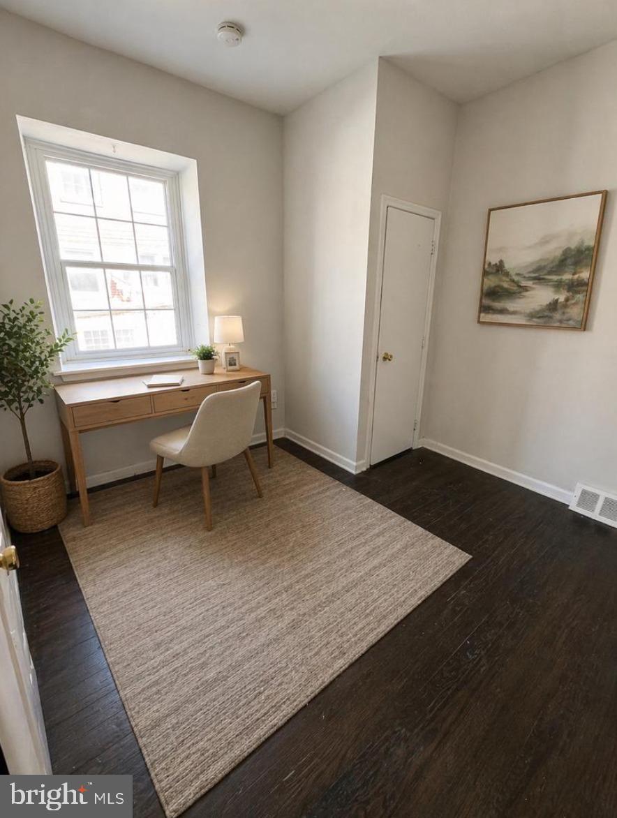 5608-00 Ridge Avenue, Unit R3 Philadelphia, PA 19128 - Photo 4 of 6 a spacious bedroom with a bed and a large window