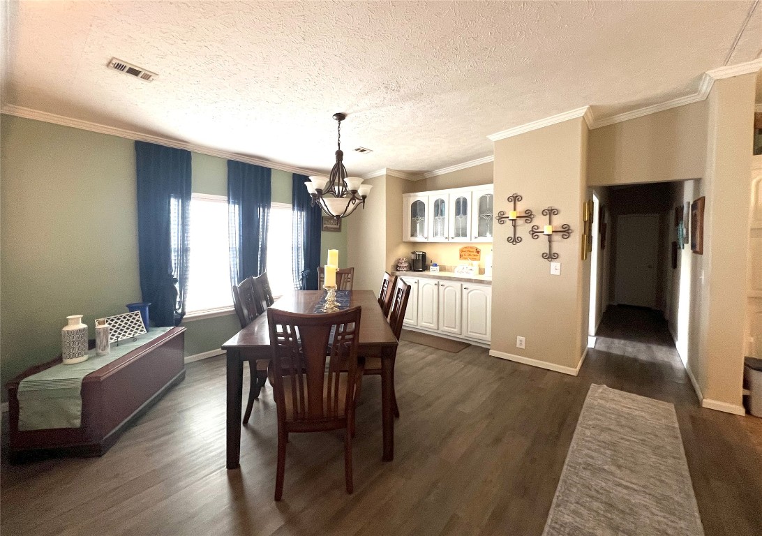 1873 FM 1163 Road El Campo, TX 77437 - Photo 11 of 48 a view of a dining room with furniture and wooden floor