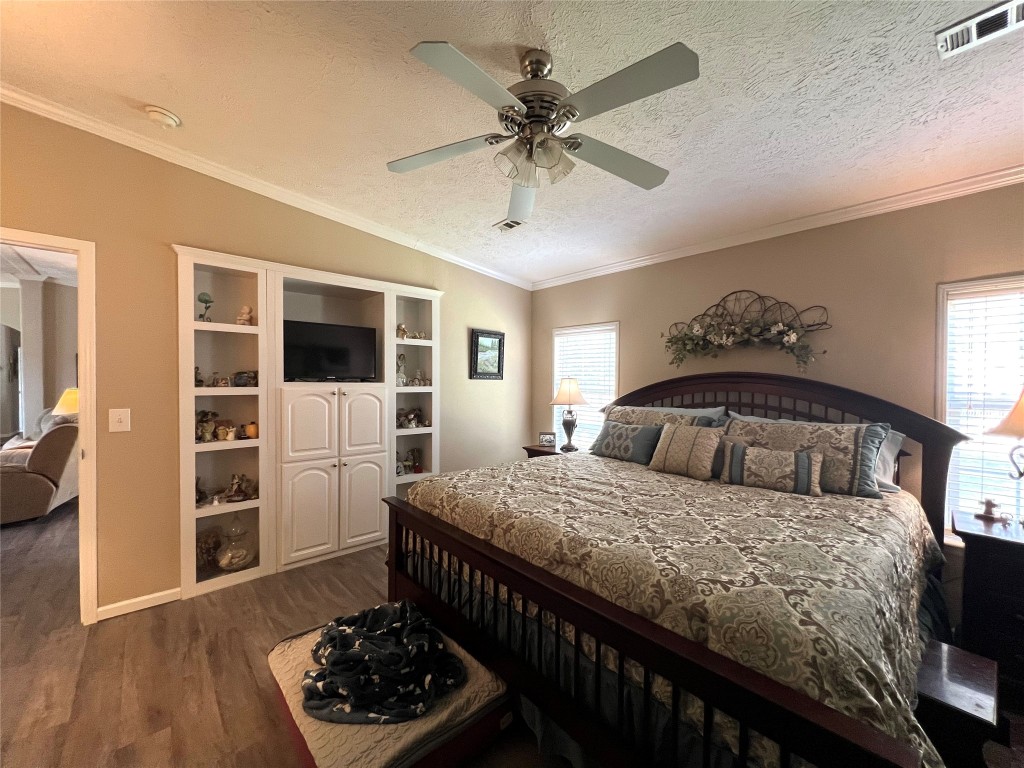 1873 FM 1163 Road El Campo, TX 77437 - Photo 13 of 48 a bedroom with a bed and a flat screen tv