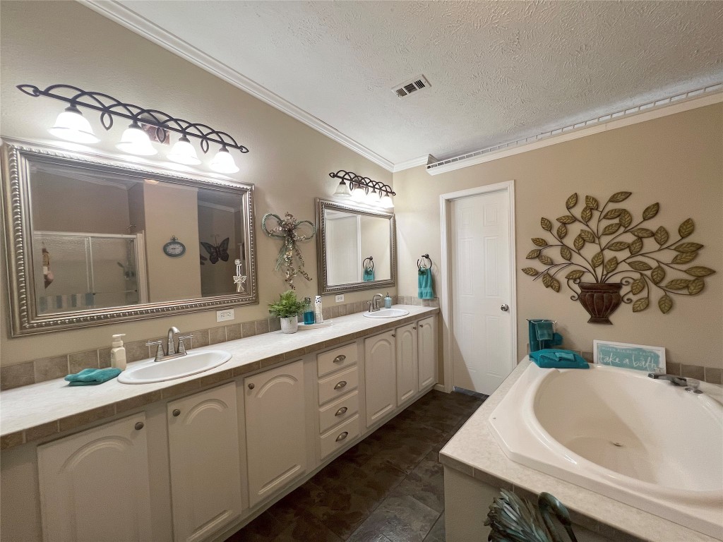 1873 FM 1163 Road El Campo, TX 77437 - Photo 14 of 48 a bathroom with a sink and a mirror