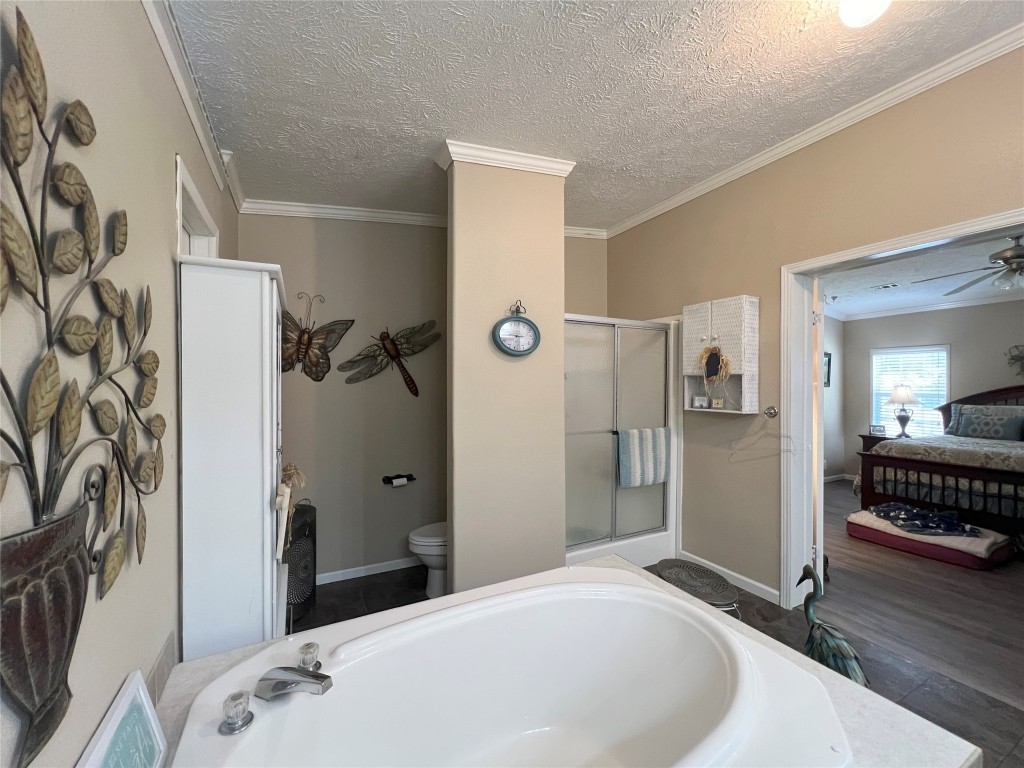 1873 FM 1163 Road El Campo, TX 77437 - Photo 16 of 48 a bedroom with a bed and a window