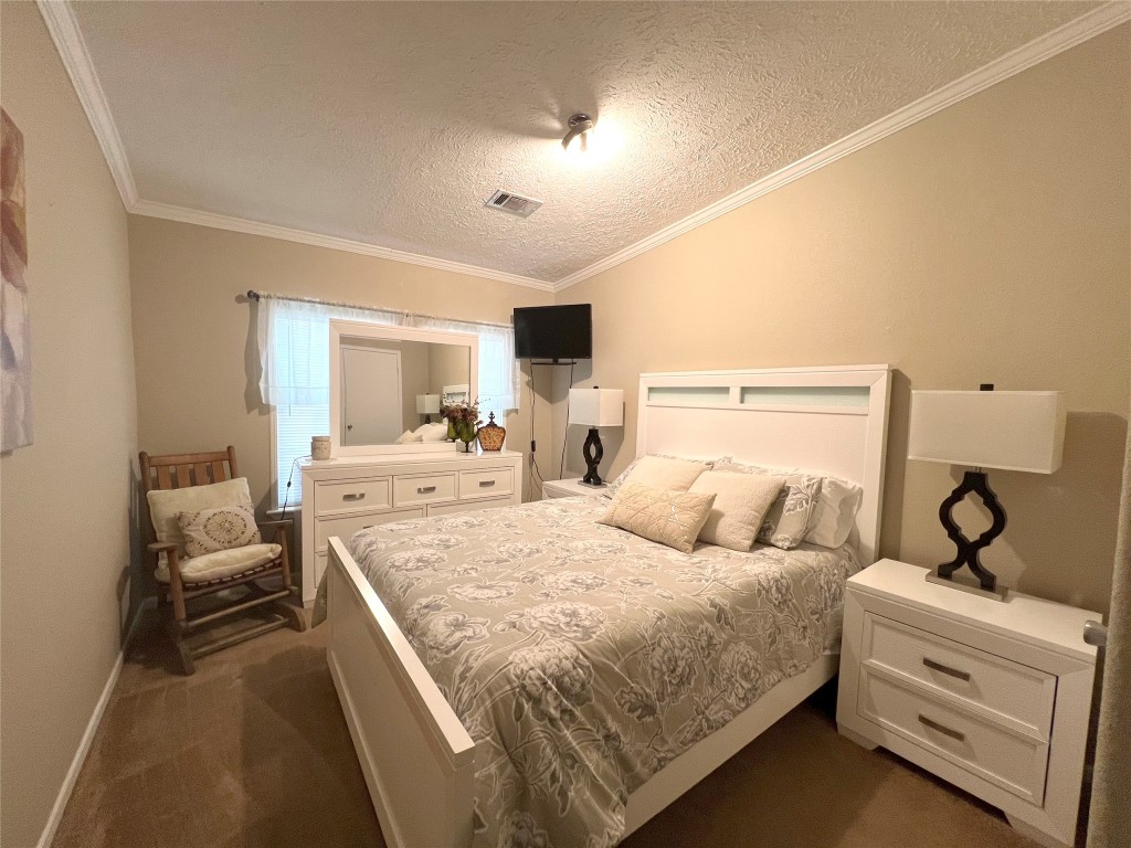 1873 FM 1163 Road El Campo, TX 77437 - Photo 17 of 48 a bedroom with bed and window