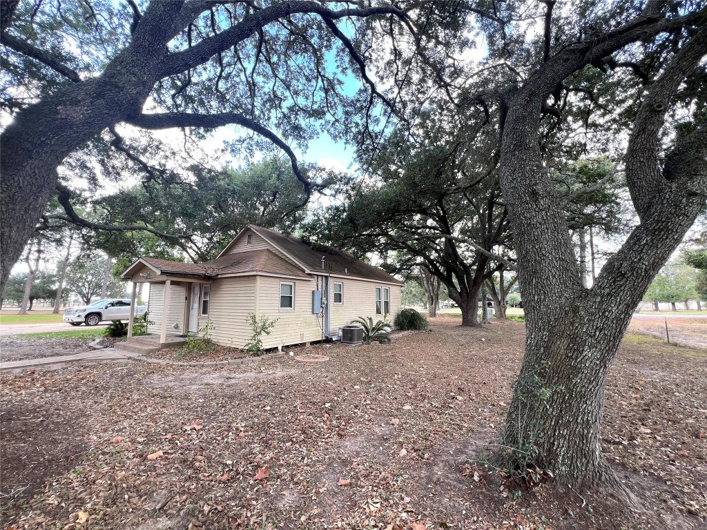1873 FM 1163 Road El Campo, TX 77437 - Photo 26 of 48 a view of a house with a tree in front of it
