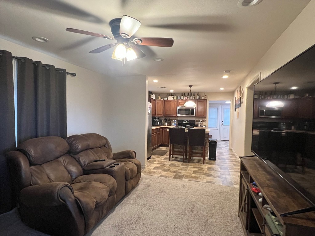 1873 FM 1163 Road El Campo, TX 77437 - Photo 28 of 48 a living room with furniture and a flat screen tv