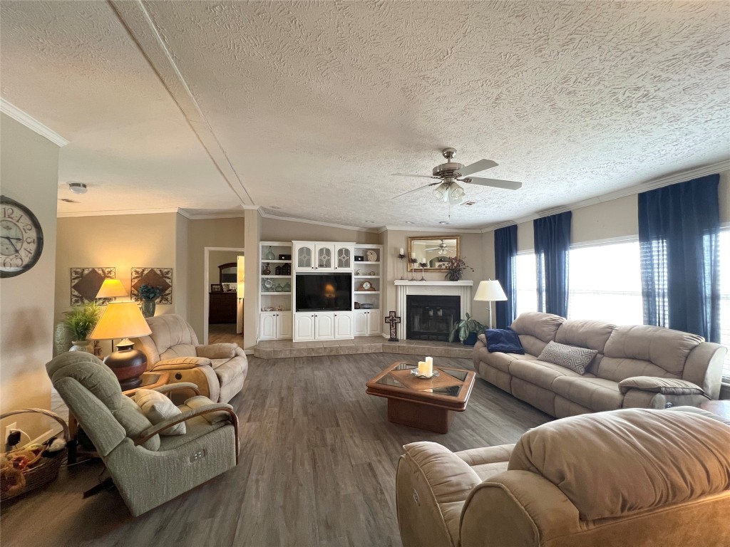 1873 FM 1163 Road El Campo, TX 77437 - Photo 3 of 48 a living room with furniture fireplace and a flat screen tv