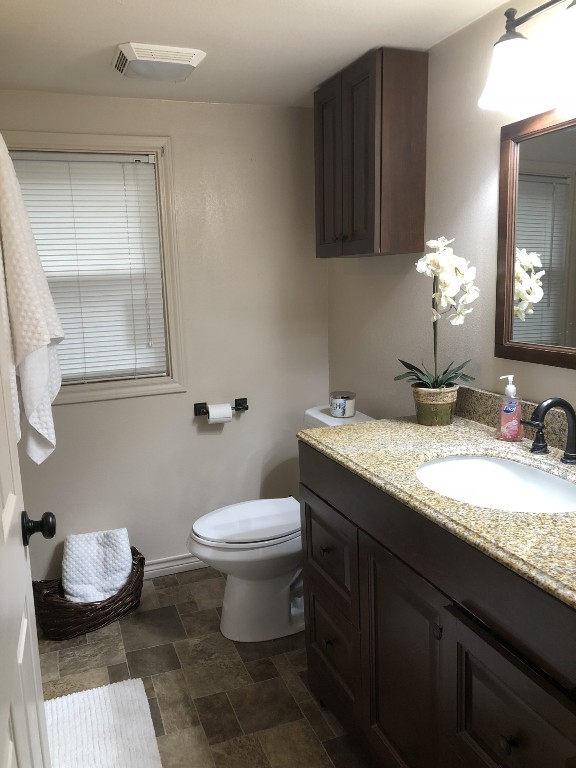 1873 FM 1163 Road El Campo, TX 77437 - Photo 31 of 48 a bathroom with a granite countertop sink and a mirror