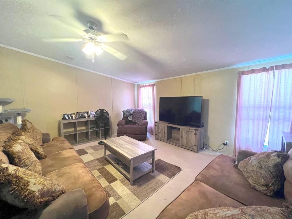 1873 FM 1163 Road El Campo, TX 77437 - Photo 35 of 48 a living room with furniture and a flat screen tv
