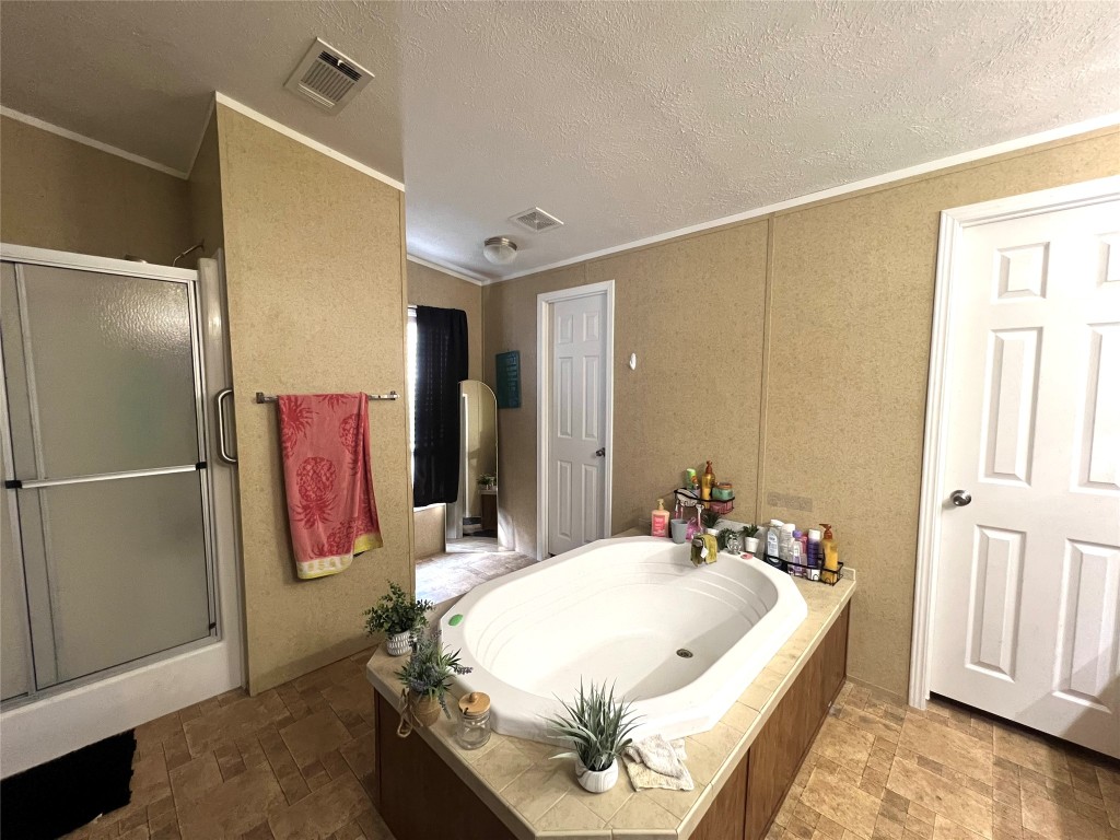 1873 FM 1163 Road El Campo, TX 77437 - Photo 41 of 48 a spacious bedroom with a bed and a window