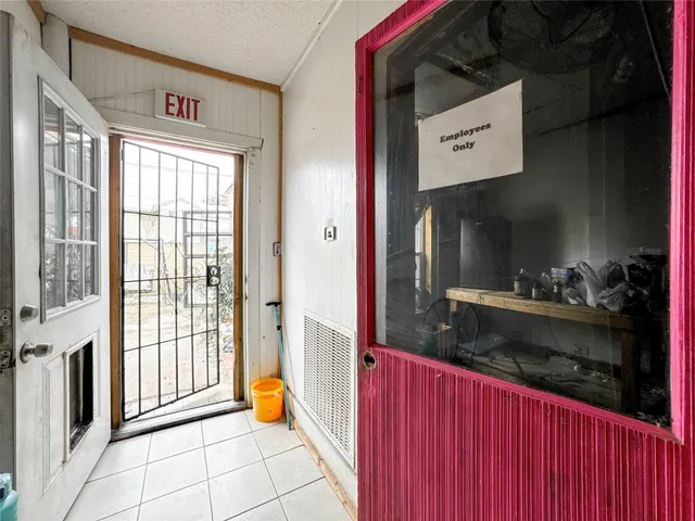 a view of a entrance and room with furniture