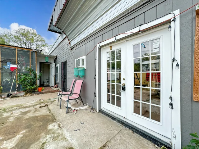 a view of a chairs and tables in patio