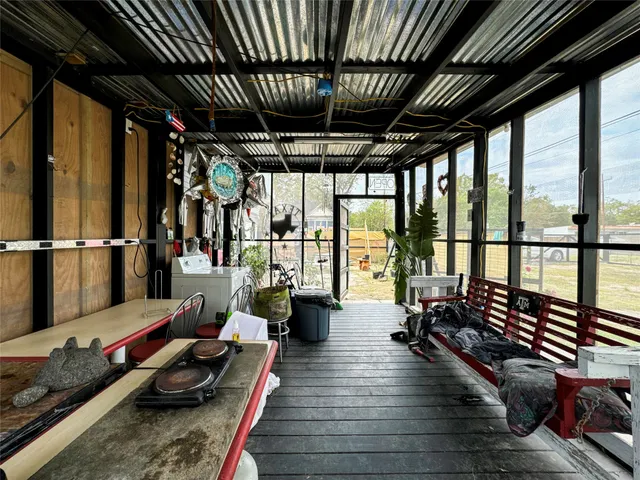 a house view with swimming pool in front of it